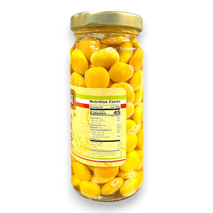 Jar of yellow olives with a label on a white background